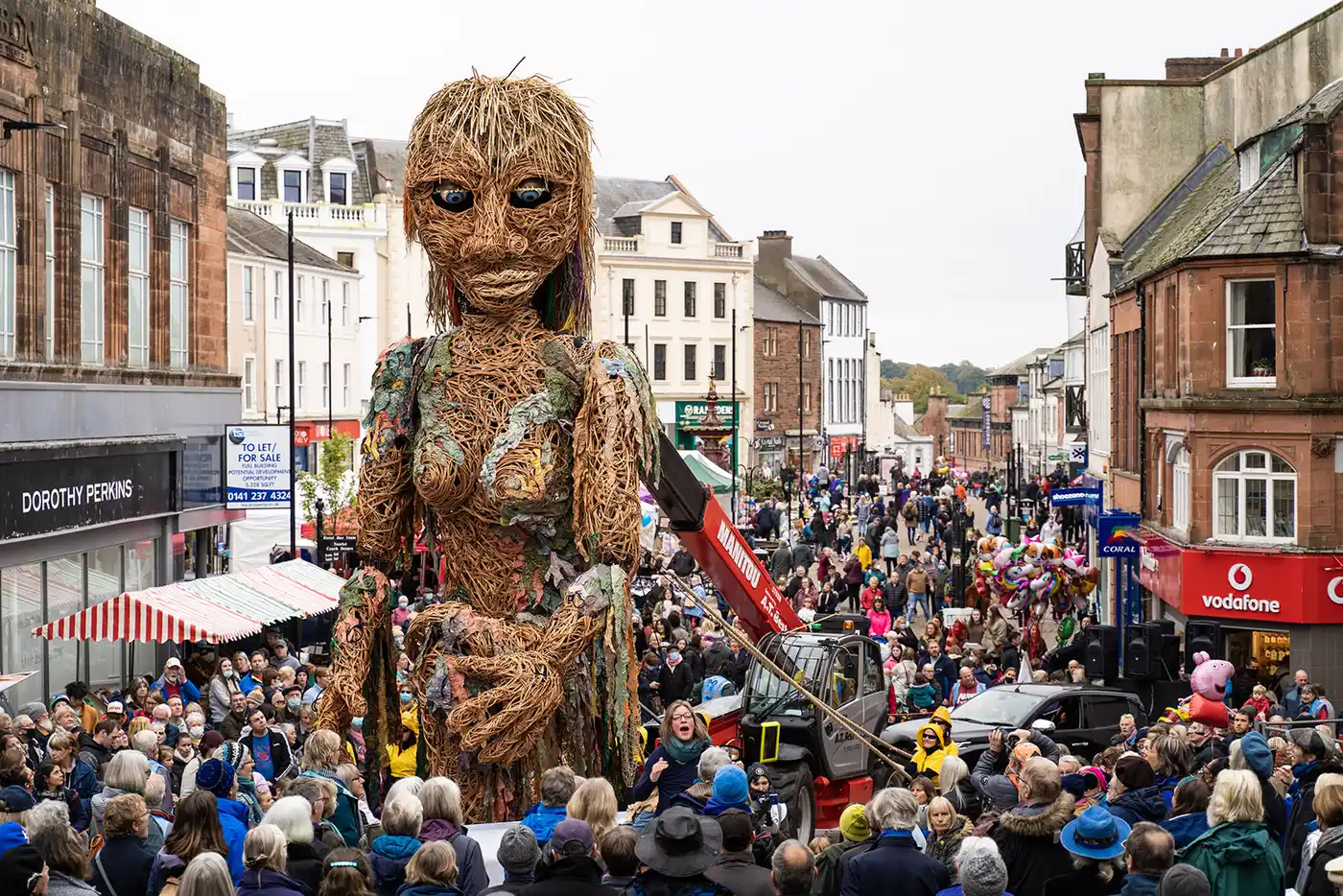 STORM event in Dumfries town centre. Large puppet parades in town with community gathering around.